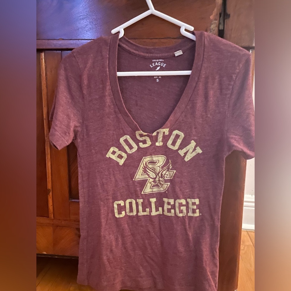 Burgundy shirt 
Original league collegiate outfitters
